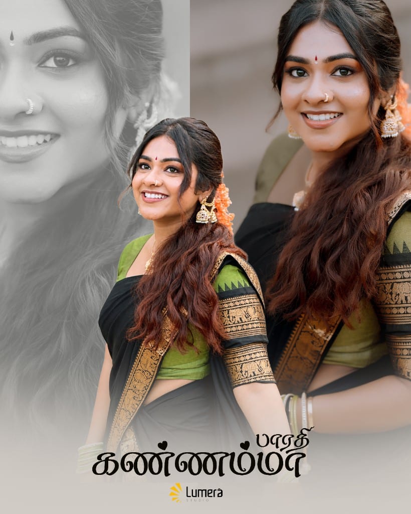 Woman in a traditional black and green saree during an outdoor portrait session at a Hindu temple setting in Jaffna, photographed by Lumera Studio.
